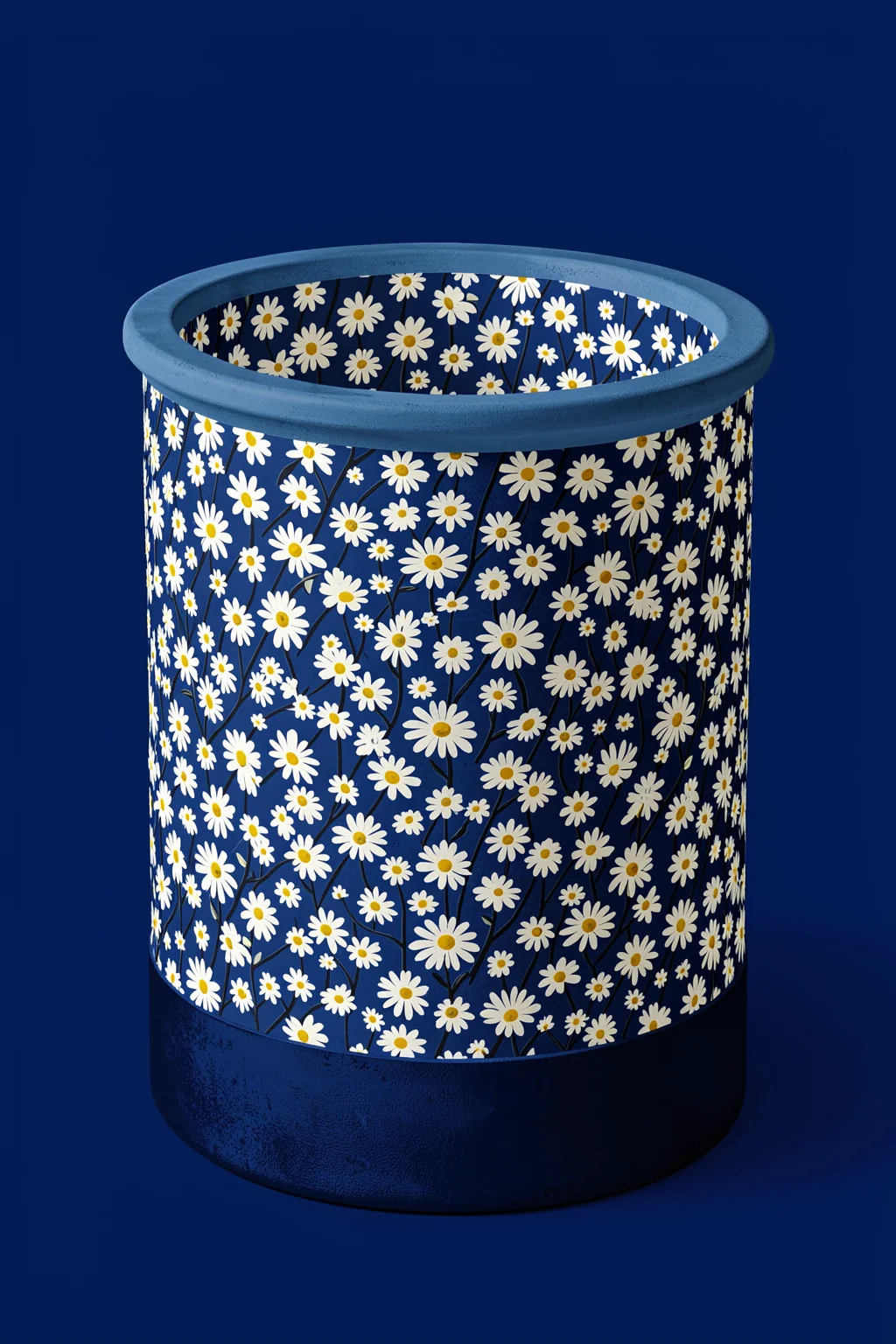 Blue Daisy Vase. A dark blue cylindrical vessel covered in small white daisies stands against a solid navy background.