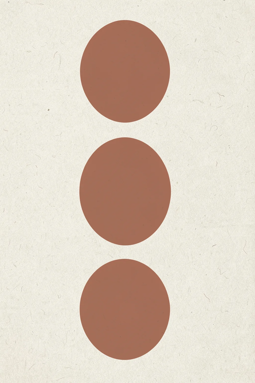 Stacked Terracotta Shapes. Three terracotta oval shapes are stacked vertically on textured off-white.