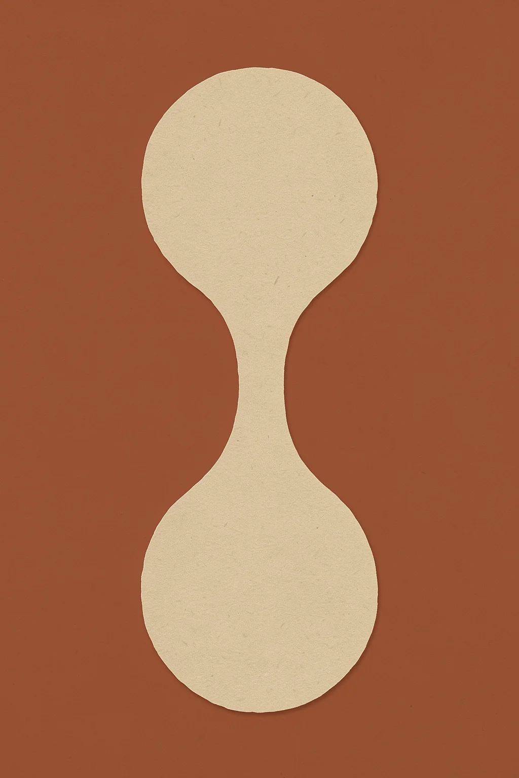 Earthy Abstract Shape. A pale ivory form, rounded at each end and pinched at the centre, stands on a muted terracotta background.