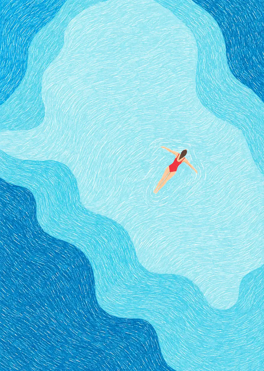 Overhead view of a red-suited swimmer floating in a turquoise pool with layered blue waves.