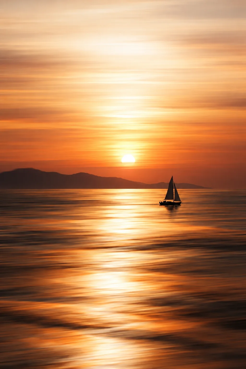 Motion-blurred sunset sea with a single small sailboat silhouetted against streaks of golden light.