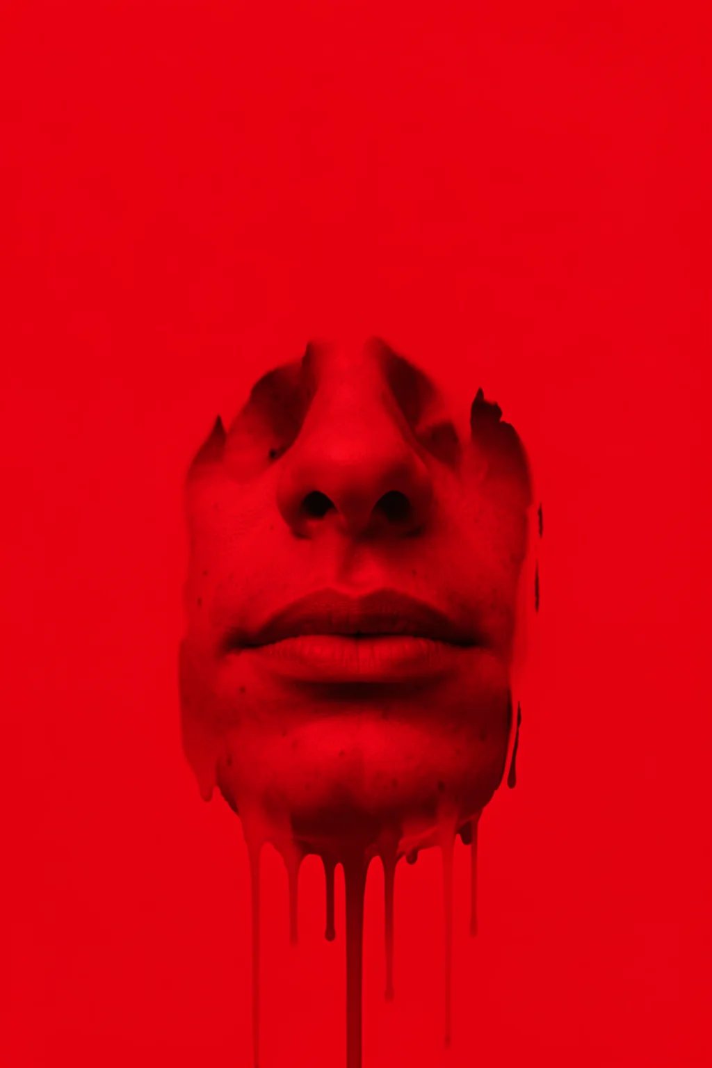 Bold Red Face. A close-cropped face appears in monochrome red, with dark paint-like drips extending below the chin.
