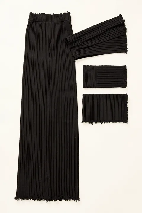 Black Paint Strokes. Black dry-brush marks and ribbed rectangular swatches are arranged vertically on white, with small floating dark strokes above.