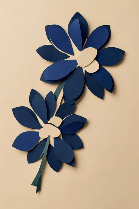 Blue Nymphaea. Two layered dark-blue flowers with broad petals are joined by stems and leaves on a warm tan ground.