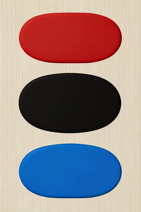 Stacked Color Blocks. Three textured pill-shaped blocks in red, black, and blue are stacked vertically on a cream field.