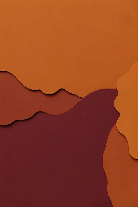 Earthy Abstract Curves. Layered flowing shapes in rust orange and deep burgundy create a textured, paper-cut-like abstract composition.