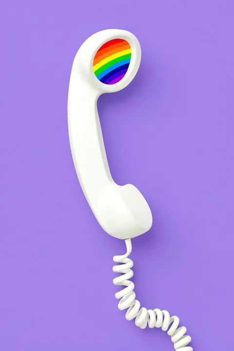 Rainbow Phone. A white retro telephone handset with a rainbow-colored earpiece and coiled cord floats on a lavender background.