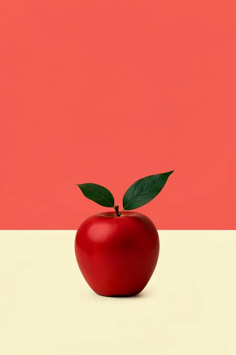 Red Apple. A glossy red apple with two dark green leaves rests on a cream band beneath a coral-red upper field.