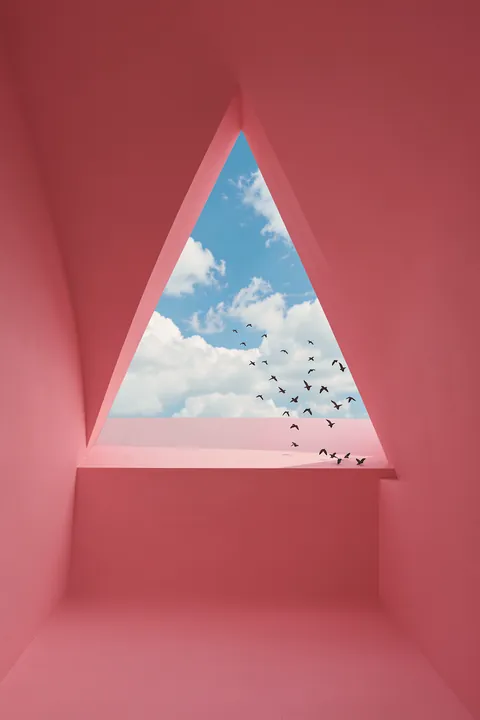 Pink Geometric Sky. A triangular opening in a pink geometric room frames a blue sky with clouds and small birds.
