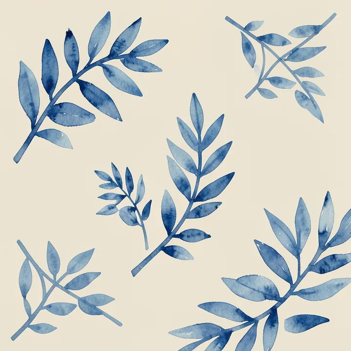 Flowing Indigo Leaves. Watercolor branches with blue and indigo leaves are scattered across a warm cream background.