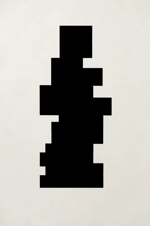Modern Geometric Blocks. A vertical stack of irregular black rectangular blocks sits on a lightly textured ivory background.