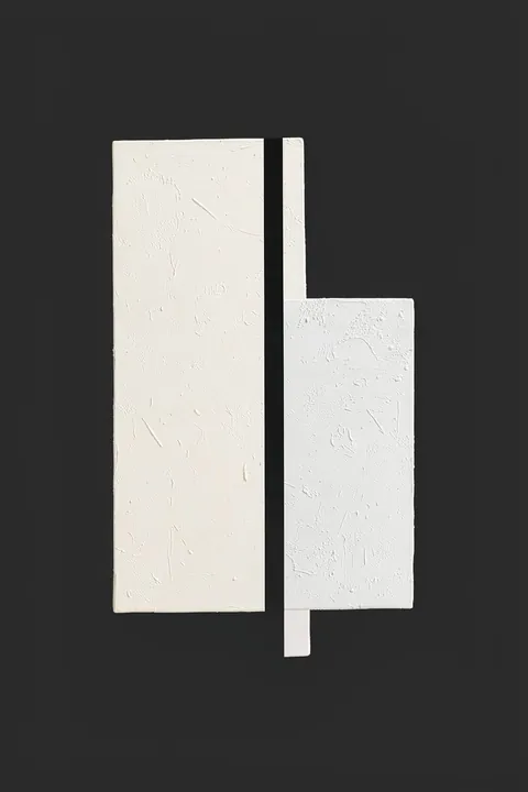 Modern Interlocking Forms. Two textured ivory rectangular forms overlap around a narrow black vertical stripe against a charcoal background.