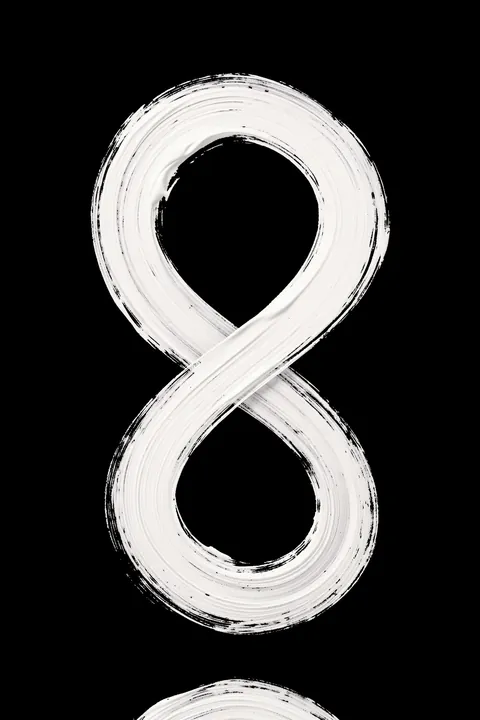 negatives_006_and. A broad white brushstroke loops into an infinity-like figure against a solid black background.