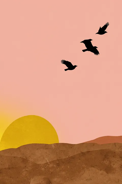 Desert Sunset Birds. Three dark birds fly across a pink sky above a low desert ridge as a yellow sun sets behind it.