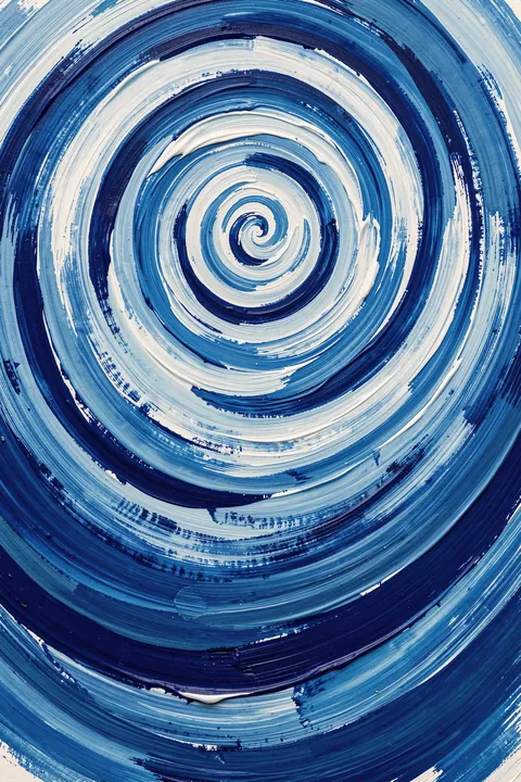 Abstract Blue Wave Swirl. A spiral of layered navy, blue and white brushstrokes fills the image in a circular wave pattern.