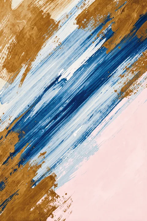 Golden Waterscape Abstract. Diagonal blue and white brushstrokes cross warm gold and pale pink fields in a textured abstract design.