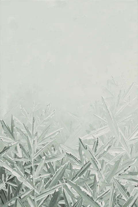 Icy Forest Serenity. Soft gray-green grasses and leafy stems emerge through a pale, misty winter landscape.