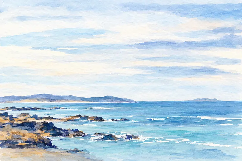 Painted shoreline of turquoise water, dark-blue rocks and a pale distant headland under a light sky.